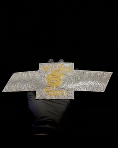It’s just paper gold plated Lettering Engraved
